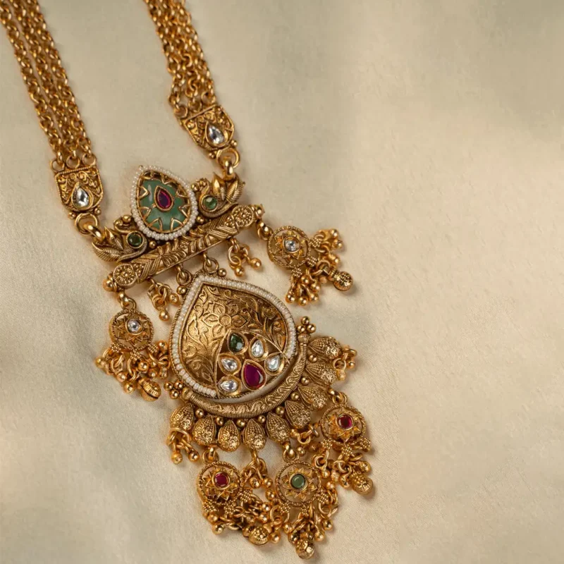 Haripriya Long Pendant Set with green meenakari, ruby accents and kundan pendant by Ruhratna