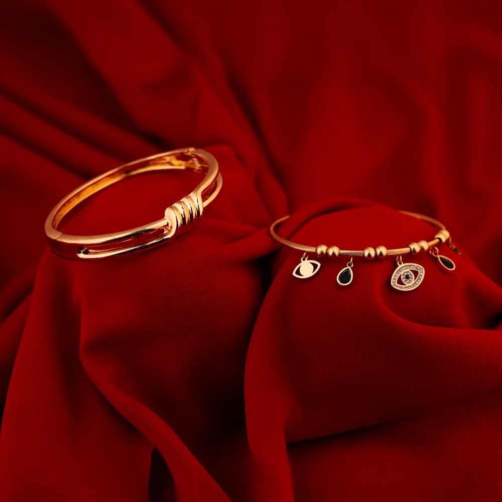 Aureus – Knot & Evil Eye Layered Bangle Duo