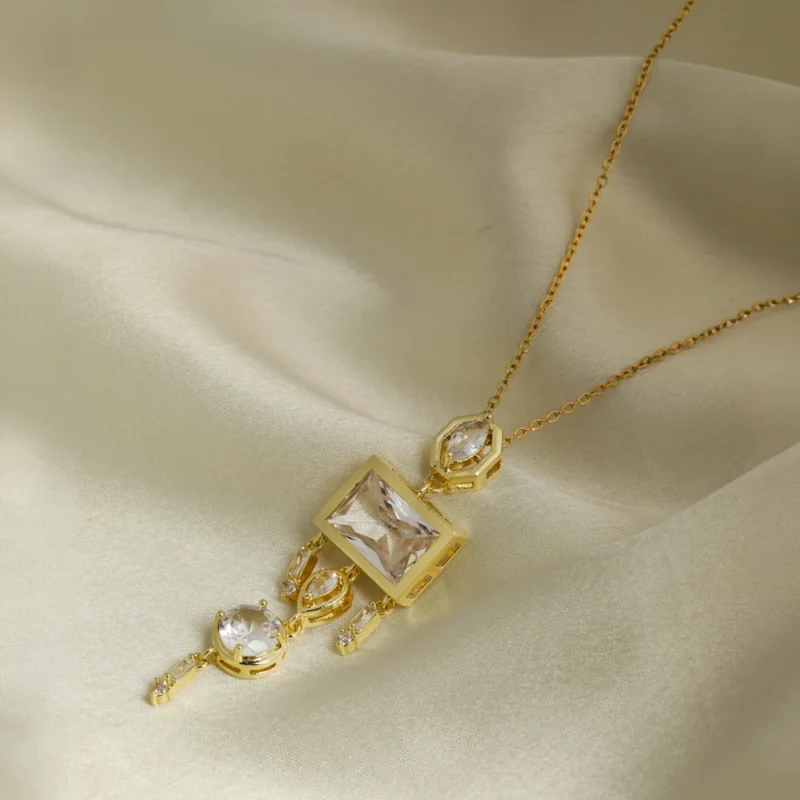 Elara Crystal Cascade pendant necklace with gold finish and sparkling crystals