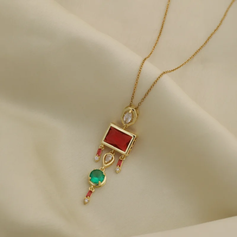 Seraphine Royale drop pendant necklace with ruby-red and green gemstones